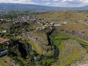 Aerial view of a scenic gorge with a small village and hills, aerial view, Kassagh River, Oskahan,