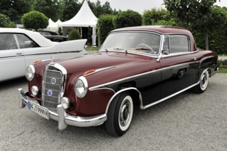 Mercedes-Benz 300, two-colour Mercedes classic car in red and black with a luxurious appearance,