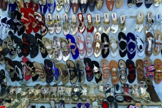 Udaipur, Rajasthan, North India, Asia, Collection of colourful shoes and sandals in a shop