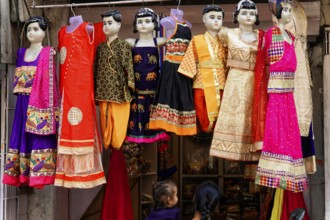 Udaipur, Rajasthan, North India, Asia, Colourful traditional dresses on mannequins in a shop