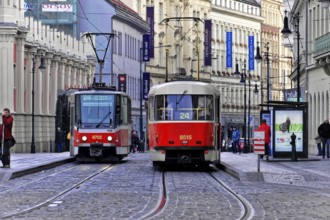Trams on the move in the city centre, Prague, Two trams in motion on a busy city street in Prague,