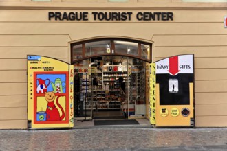 Prague, Czech Republic, Europe, Colourful shop front of a tourist centre with open doors and