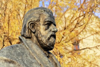 Smetana Monument, Prague, Czech Republic, Europe, Close-up of a bronze statue with autumn leaves in