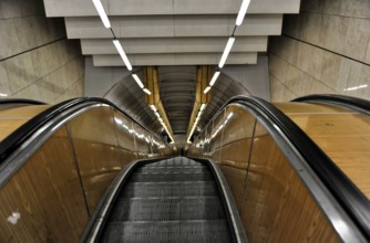 Prague, Czech Republic, Europe, Long escalator in a modern, symmetrical tunnel design