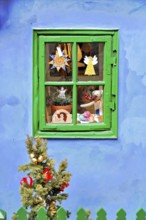 Prague, Czech Republic, Europe, Close-up of a decorated window with colourful toys and presents
