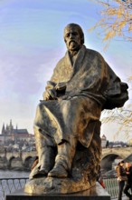 Smetana Monument, Prague, Czech Republic, Europe, Stone figure of a man with historical city