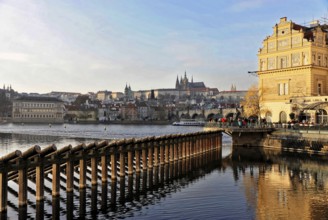 Prague, Czech Republic, Europe, sunlight reflected on the water, Prague in the background,