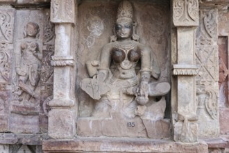 Kota, Rajasthan, North India, Asia, Stone deity in traditional pose at an Indian temple, India