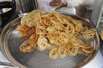 Kota, Rajasthan, North India, Asia, A tray of freshly prepared jalebis, a popular Indian sweet,