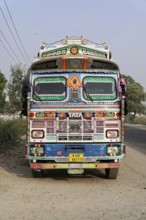 Kota, Rajasthan, North India, Asia, Colourfully decorated Indian truck on the shoulder of a country