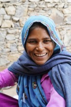 Sawai Madhopur, Kota, Rajasthan, North India, Asia, Woman in blue and pink clothes smiling with a