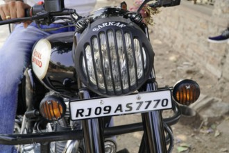 Kota, Rajasthan, North India, Asia, Close-up of a Royal Enfield motorbike with visible number