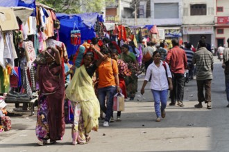 Kota, Rajasthan, North India, Asia, Lively market with people of different ages between colourful