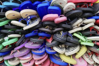 Kota, Rajasthan, North India, Asia, pile of colourful plastic sandals expressing diversity and