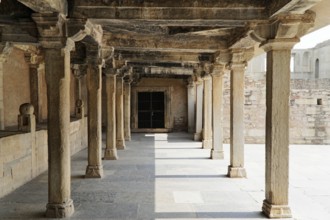 Kota, Rajasthan, North India, Asia, An old stone colonnade full of shadow and light, part of a