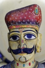 Udaipur, Rajasthan, North India, India, Asia, Traditional wooden figure with moustache and detailed