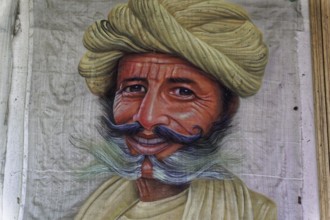 Painting, Sale, Souvenir, Udaipur, Rajasthan, India, Asia, Portrait painting of a man with smiling