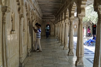 City Palace, Udaipur, Rajasthan, India, Asia, A long corridor decorated with stone carvings and