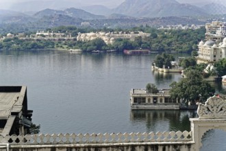 City Palace, Udaipur, Rajasthan, India, Asia, View over a lake with palaces and mountains in the