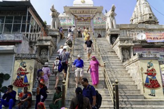 Entrance to Jagdish Temple, Udaipur, People climbing the steps to a temple flanked by statues under