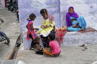 Udaipur, Rajasthan, North India, India, Asia, Group of children in colourful clothes playing and