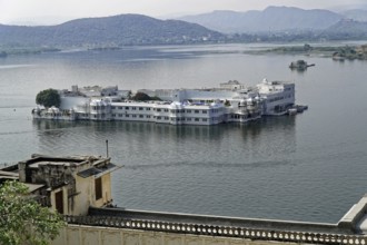 Lake Pichola overlooking Lake Palace, Udaipur, Rajasthan, India, Asia, Palace on a lake surrounded