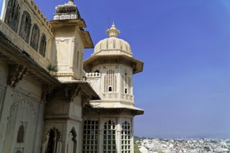 City palace, Udaipur, Rajasthan, India, Asia, Close-up of a palace with ornate domes and windows