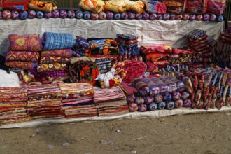 Colourful handmade cushions and textiles on a market stall, Agra, Jodhpur, Rajasthan, North India
