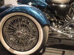 Shiny motorbike wheel with chrome spokes and white-walled tyres, dortmund, deutchland