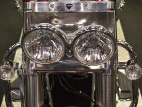 Shiny chrome double headlights of a motorbike in retro style, dortmund, deutchland