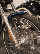 Front wheel of a classic motorbike with chrome rim and wire spokes, dortmund, deutchland