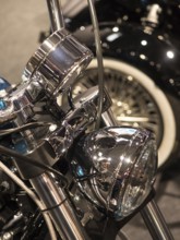 Chrome headlights with detailed wiring on a classic motorbike, dortmund, deutchland