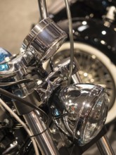 Detailed view of chrome-plated headlights of a vintage motorbike, dortmund, germany