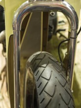 Close-up of a motorbike tyre with shiny chrome suspension, dortmund, deutchland