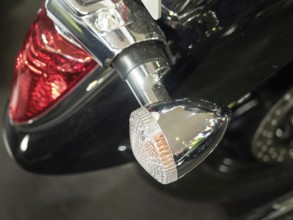 Detailed view of a motorbike tail light and indicator in chrome with black paint, dortmund,