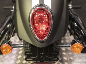 Close-up of a motorbike tail light with red and orange indicators, dortmund, deutchland