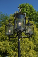 Decorative lantern with clear sky and tree in the background, südlohn, westphalia, germany
