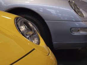 Details of yellow and silver Porsche showing headlights and luxurious design, Cologne, Germany