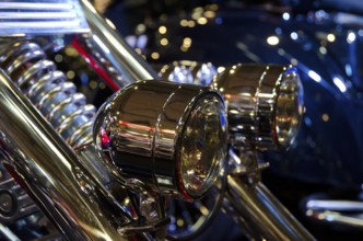 Detailed view of shiny headlights on a motorbike with light-reflecting atmosphere, dortmund,