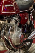 Classic red Honda motorbike with detailed view of the engine, dortmund, germany