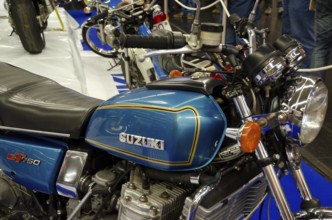 Blue Suzuki motorbike GT750 in retro style with chrome-coloured details at a trade fair, dortmund,