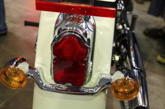 Close-up view of a motorbike tail light with chrome-coloured details and a white housing, dortmund,