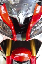 Sporty Yamaha motorbike in red and white colour with distinctive headlights and logos, dortmund,
