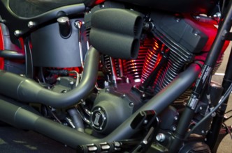 Detailed image of a motorbike engine block with red illuminated components, dortmund, germany