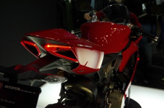 Sporty red motorbike with detailed rear design at an exhibition, dortmund, germany