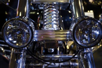 Motorbike with shiny double headlights and chrome at night, dortmund, germany