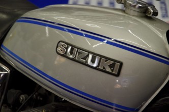 Detailed view of a Suzuki motorbike tank with blue stripes, dortmund, germany