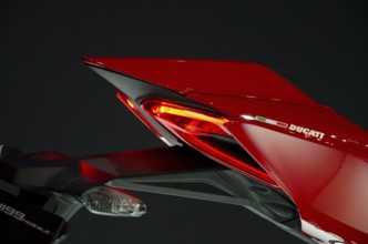 Side view of a Ducati motorbike rear end with red tail light, dortmund, germany