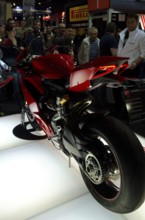 Red sports machine at a trade fair, rear view shows details of the design, dortmund, germany