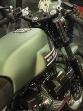 Green Moto Guzzi motorbike tank with technical details and accessories, dortmund, germany